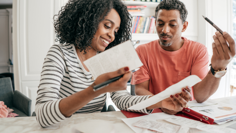man and wife checking financial statements