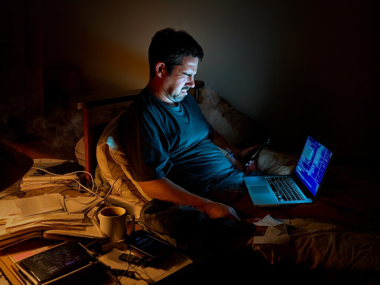 man up late looking at a laptop